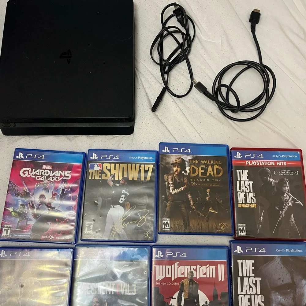 Sony PlayStation Console with Black Finish and Game Collection